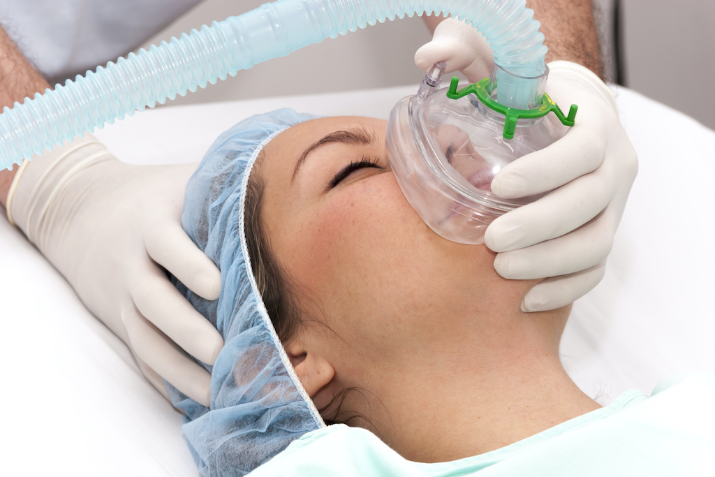 woman receiving anesthesia for an oral surgery
